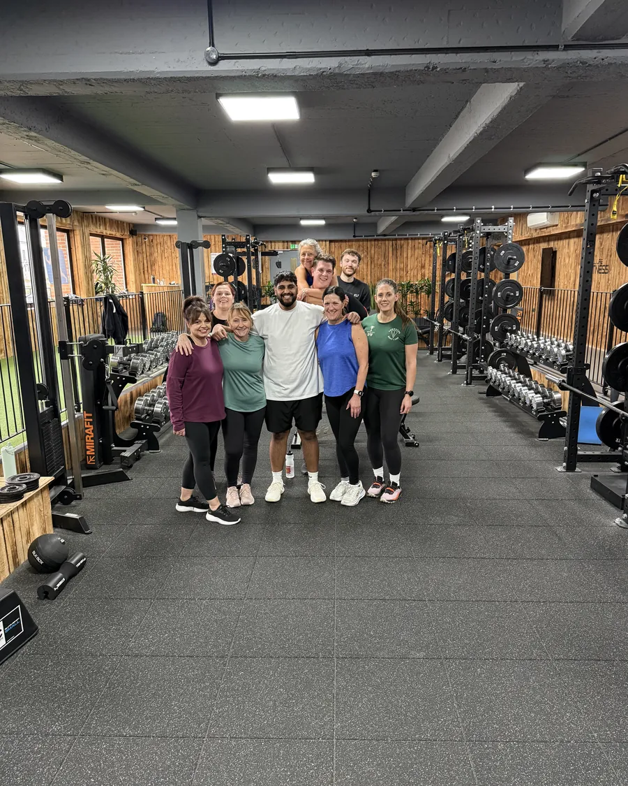 Members with their arms around each other after a session