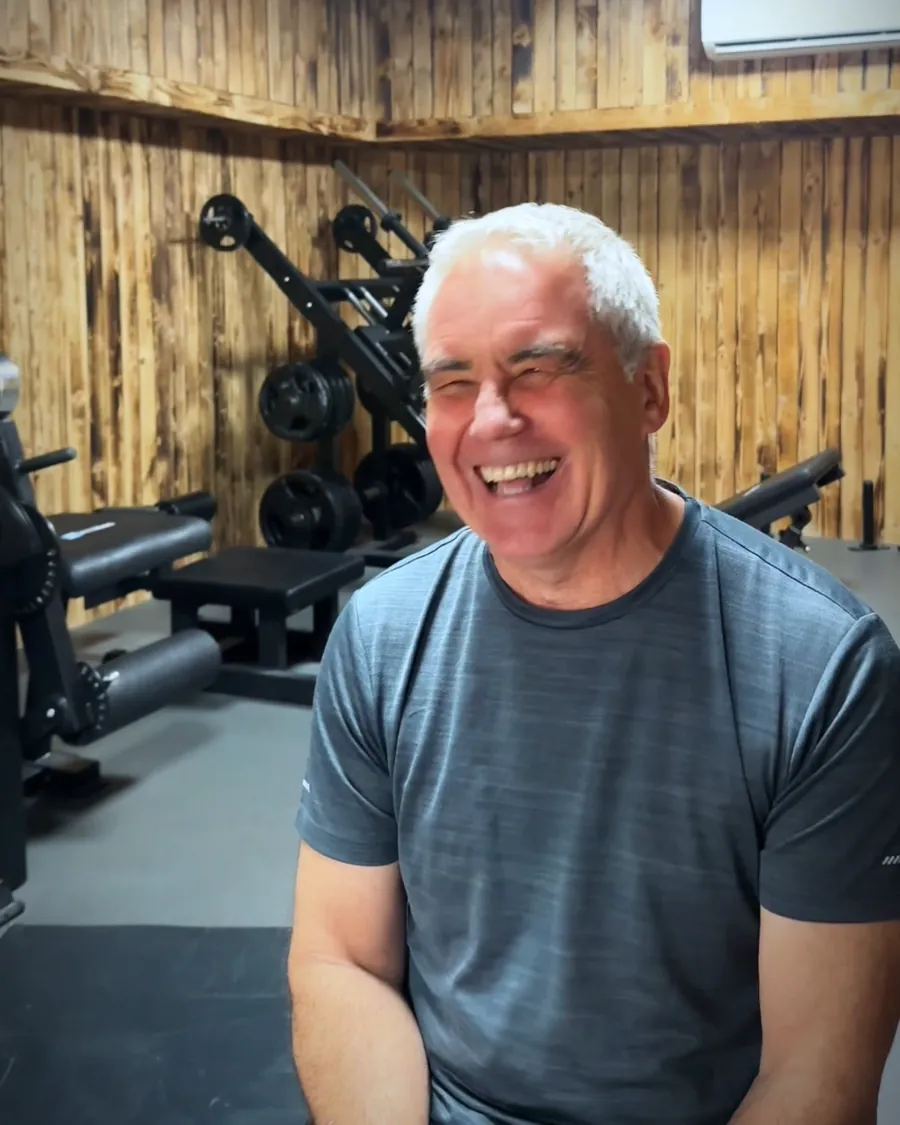 A member in his sixties smiling in the training room